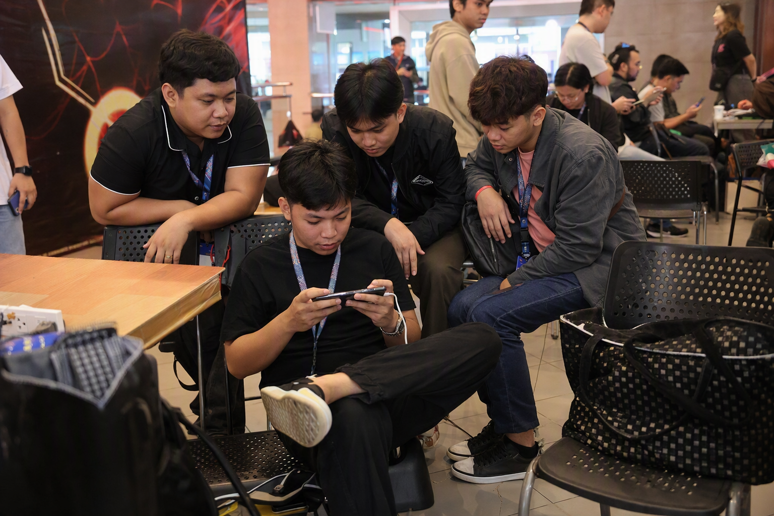 Four mobile competitors coordinating at an independent event in Manila