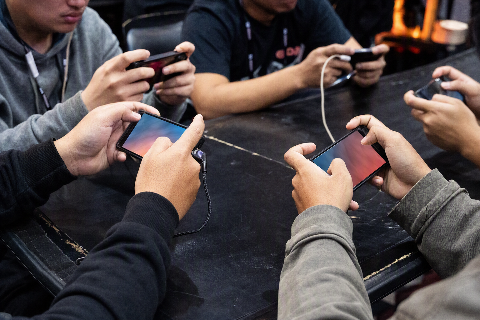 Competitors reviewing tournament rules on a handheld device before a match
